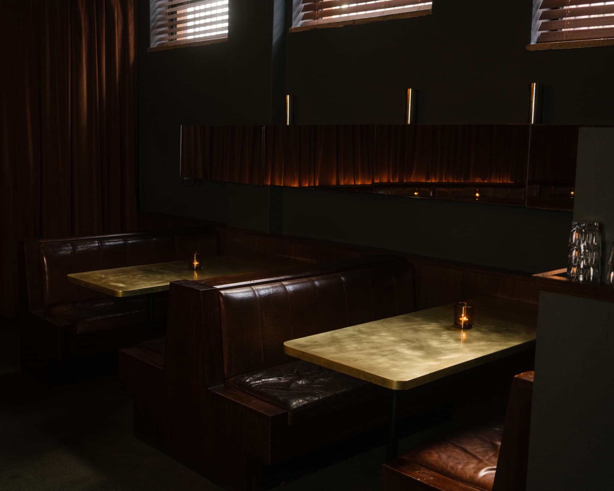 The bar at Golden Age Cinema and Bar, with its intimate booth seating and low-lit atmosphere. Photo: Golden Age Cinema and Bar